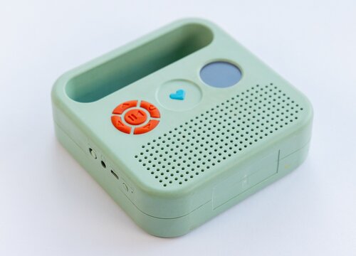Mint Green Portable Childrens Audio Player with Orange Control Buttons