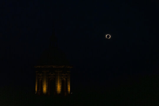 Church Tower Against the Spectacle of a Solar Eclipse