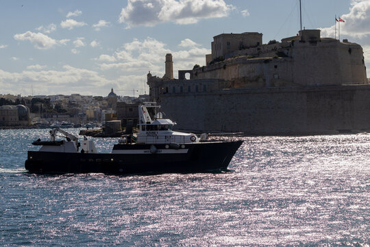 Valletta, Malta - October 14th, 2026 Commercial Patrol Boat Azure 1 Cruising Past Valletta Coastal Cityscape on a Sunny Day