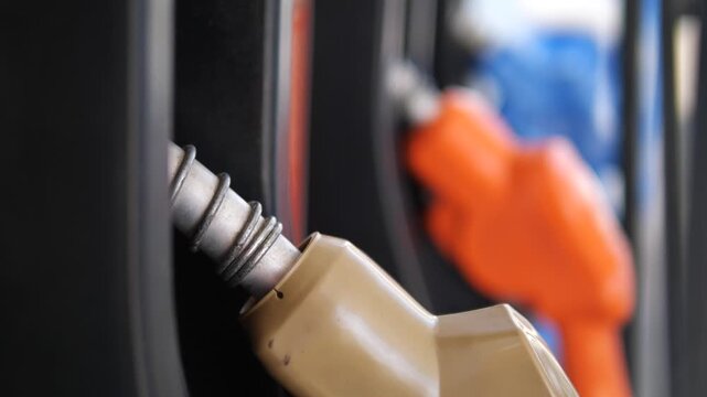 Close up of fuel nozzles at gas station