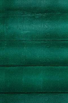Old aged vintage antique green book spine cover background backdrop. Vintage books concep