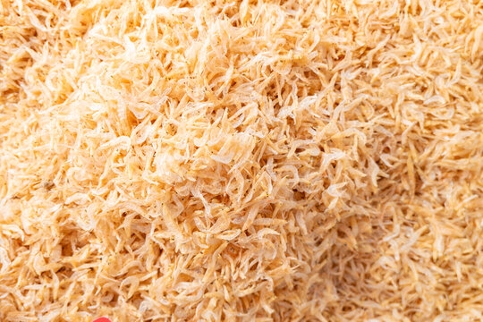Dried translucent shrimp piled densely as preserved seafood ingredient