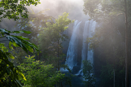 Huai Luang Waterfall Glowing in Morning Mist and Sunlight