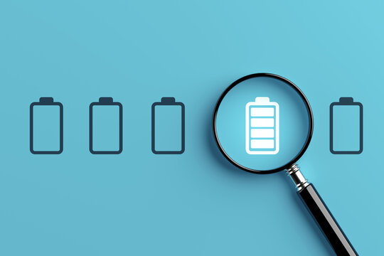 Energy Efficiency Concept. Magnifying Glass Highlights A Full Battery Among Empty Battery Icons On Cyan Background. 3d Rendering