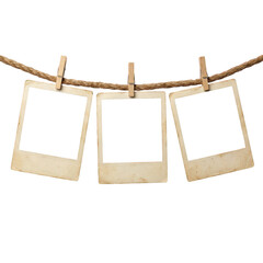 Three vintage photo frames hanging on a rope with clips © Raja