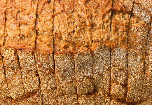 close up of whole grain yeast-free buckwheat bread with flax seeds, food textured. Background of buckwheat bread with flax seeds. Whole grain yeast-free buckwheat bread close up.