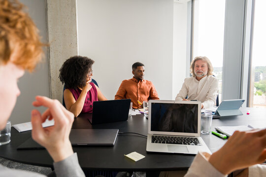 Conversation in Modern Office During Meeting