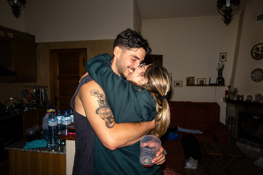 A happy kiss in the kitchen