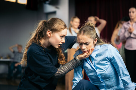 Anguished gesture between performers
