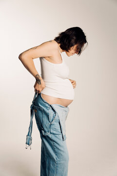 A pregnant woman in profile