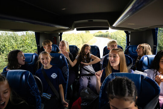 Dance company sings along on the coach