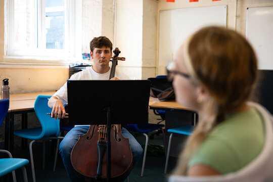 Cello practice with a classmate nearby