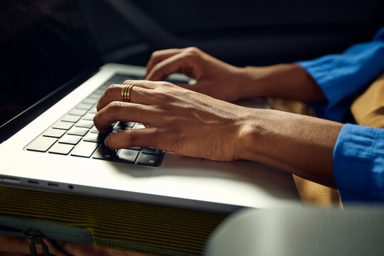 Person commutes by car, using a laptop
