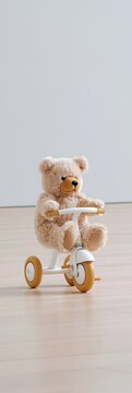 Plush teddy bear rides a tricycle on a wooden floor