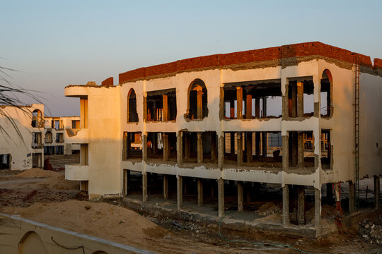 Abandoned building construction site with hotel structure under development
