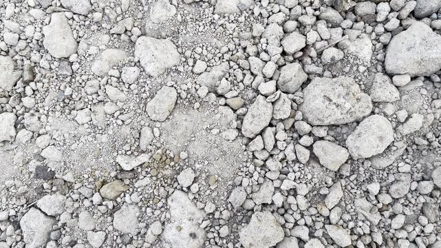 Dry rocky ground texture with small stones and pebbles