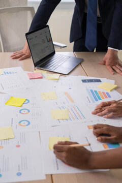 Business hands creating project financial charts and data mind map with colorful sticky notes