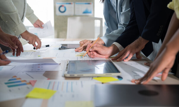 Business hands creating project financial charts and data mind map with colorful sticky notes