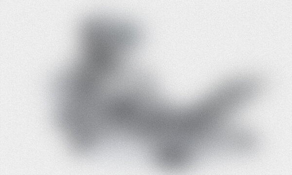 Abstract blurred dark gray shape on a light background