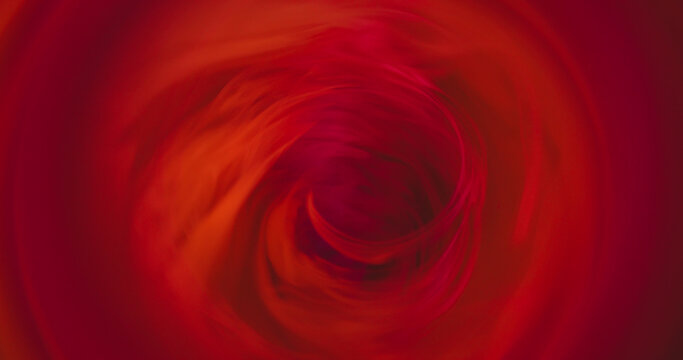 Defocused spiral. Mist color wave. Bright red swirl flow abstract background. Fume portal hot spin blend circle crater frame texture.