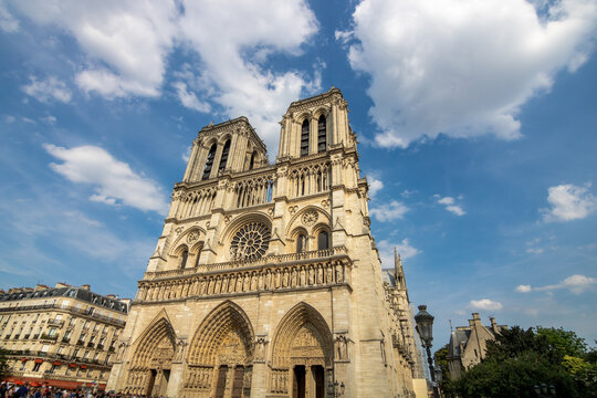 Gothic facade of Notre Dame Cathedral in Paris, France before the roof fire