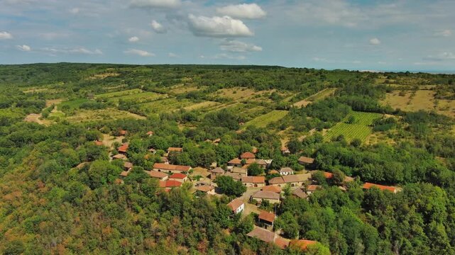 Aerial around view of old rustic vintage houses with wine cellars in Rogljevacke pivnice in Negotin region of Serbia, 4k
