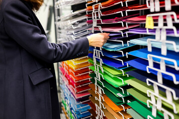 Colored paper close up. Color paper, cardboard and holiday greetings choosing. Preparing for the holidays in art store. Art store concept, color choice concept.  © Iryna