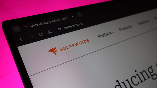 Solarwinds observability and database monitoring platform logo on computer screen illustrating it management software for enterprise network and data systems.