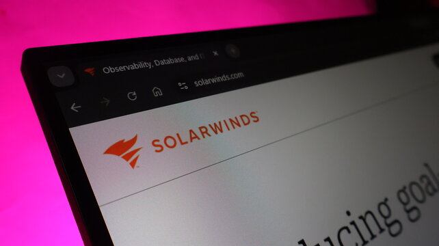 Solarwinds corporate branding on digital display showing official website for network management and it performance monitoring services for large organizations.