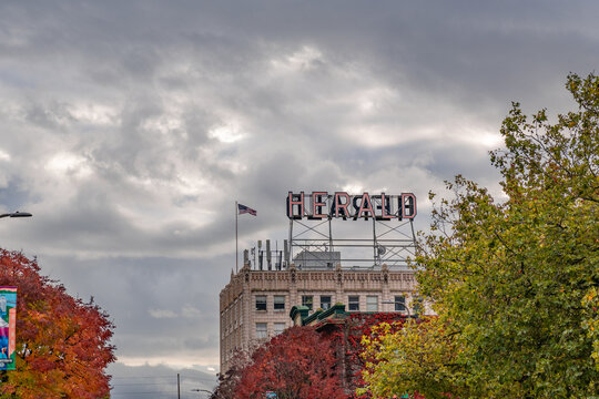 Bellingham, WA, US-September 25, 2026: Downtown district with the historic Herald newspaper sign against dramatic sky.