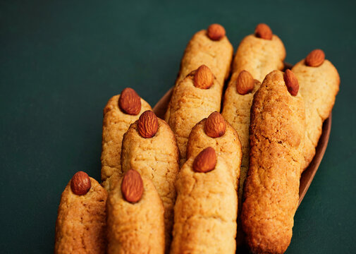 Almond cookies with golden crust and whole almonds, perfect for family gatherings and baking events