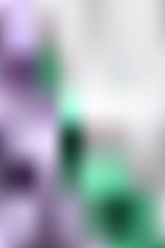 Abstract purple and green gradient mesh background with violet and emerald color waves