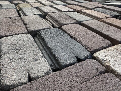 Textured multi-colored concrete blocks arranged in rows
