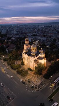Dormition of the Theotokos Cathedral illuminated at twilight in Varna Bulgaria
