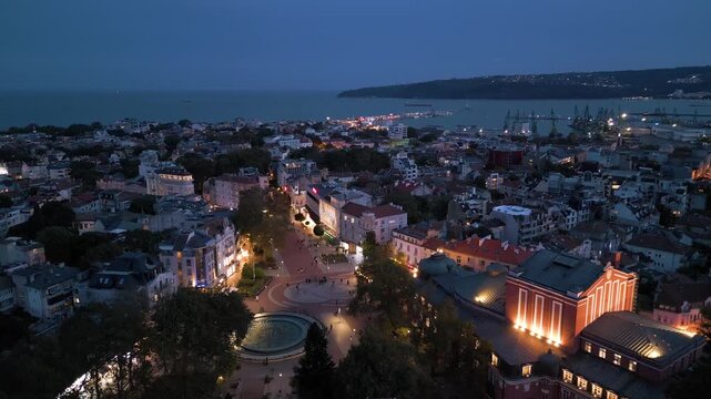 Aerial view of Varna city center, theater, and port at twilight, Bulgaria