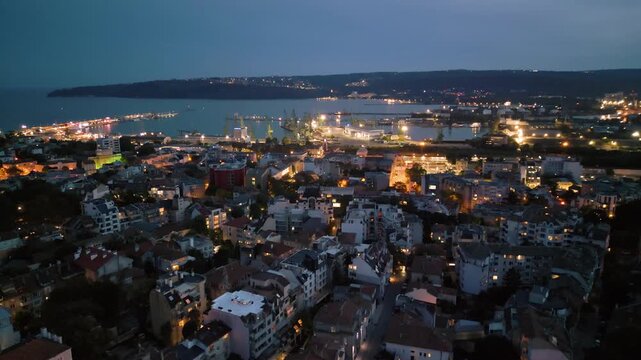 Aerial view of Varna port and illuminated city bay at twilight, Bulgaria
