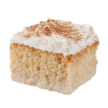 Delicious square slice of tres leches cake with fluffy whipped cream and a dusting of cinnamon on a clean white background