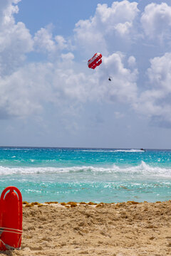 Parasailing Above Caribbean Surf on a Cloudy Day at Cancun Beach, Mexico