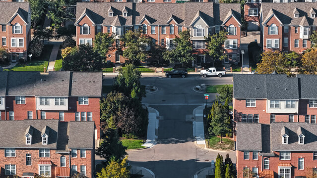 Aerial view suburban residential townhouses neighborhood street