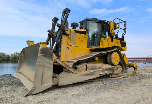 Yellow Bulldozer by the River