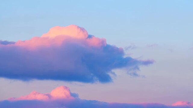 Pastel pink and lavender clouds drift across a soft blue sky. Dream sequences, fantasy productions, and poetry content.