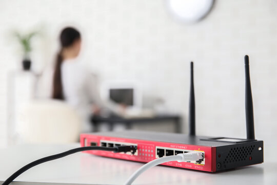 Network connectivity and internet infrastructure, ethernet router with cables in office for remote work and digital communication technology solutions