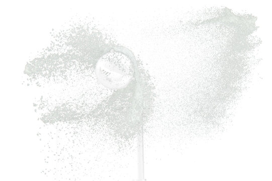 Fluffy White snow splash flying or throwing in mid air. Snowfall on Black background isolated. Snow dust element falling over dark night
