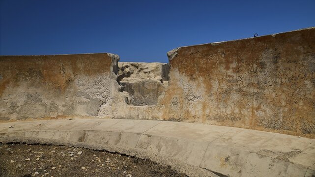 Erosion on concrete wall of an old ruin under blue sky, Lost Place, Air Defence Position, Aerophone, Parabolic Acoustic Mirror, Patella Mountain, WW2, west of Lakki, Leros, Dodecanese, Greek Islands, Greece