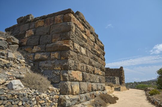 Desert landscape with ancient ruined wall and a clear blue sky, Palaiokastro, ancient fortress, 3rd and 4th century BC, above Mandraki, Nisyros, Dodecanese, Greek Islands, Greece