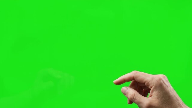 Hand finger point touch gesture on green screen interaction with curious focused digital virtual interface chroma key concept