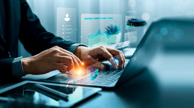 Business data analytics concept with professional using laptop and virtual dashboard showing KPI metrics, performance charts, statistics, trends and data driven decision strategy