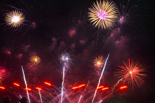 Purple firework in night time celebrate national holiday. Purple Firework celebrate anniversary happy new year 2027, 4th of july holiday festival. Violet firework Countdown to new year 2026 festival