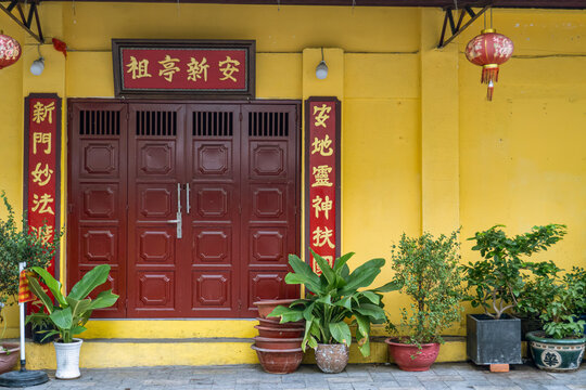 five elements temple entrance with plant pots in ho chi minh city vietnam