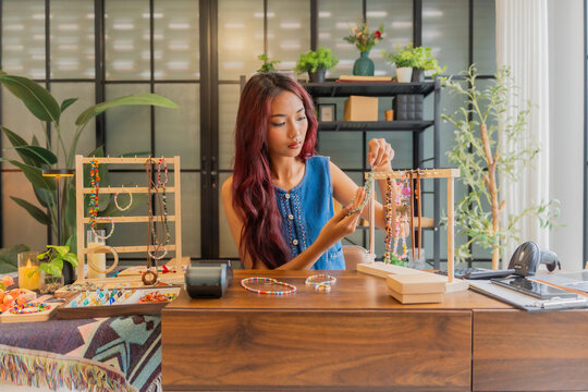Asian business owner qc all handcrafted jelvery in store